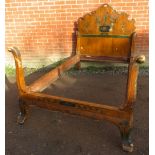 A vintage Continental tulipwood single bed, hand decorated with mythical creatures in a Neo-