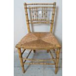 A Regency faux bamboo occasional chair, bearing original polychrome paint, with rush seat. Condition