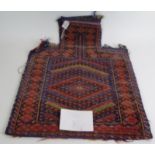 An Afghan baluch salt bag mid 20th Century rug face & Kelim weave on back. Estimated: £60-£80.