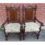 A pair of good quality reproduction oak throne chairs in an 18th century style, featuring baluster