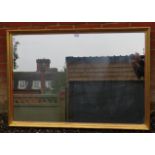 A large bevelled rectangular wall mirror in a moulded gilt gesso frame. Condition report: Some