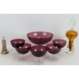 A six piece amethyst glass fruit set, studio glass perfume bottle signed Verrerie D'Art D'Avignac