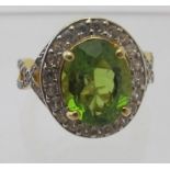 Peridot gemstone ring, 17mm x 13mm portrait setting, ring size M/N, 14k yellow gold 925.