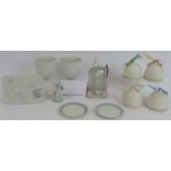 Eleven pieces of collector's Lladro porcelain including four bells, two votives, two coasters, two