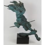 A large bronze sculpture of a violinist in semi abstract form mounted on a black marble base,