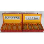 A set of 8 Chinese erotic inside-painted glass snuff bottles, contained within 2 boxes, 20th