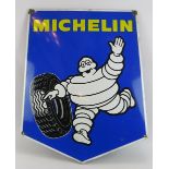 A large vintage enamel shield shaped Michelin Tyres advertising sign, 63cm x 77cm. Condition report: