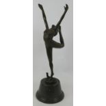 A bronze figure of a snake dancer in the Art Deco style, mounted on a black marble plinth, unsigned.