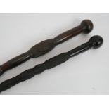 Two African carved knobkerrie sticks, each with diamond carved shafts. Longest 86cm (2). Condition
