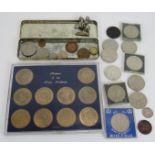 A collection of coins and medallions including a 1900 silver Morgan US dollar, 1886 North Borneo one