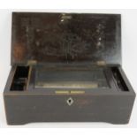 A late 19th Century Swiss music box, possibly by Jacot. Inlaid stained mahogany case with cylinder