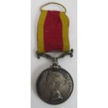 A Victoria British China medal (undated) with ribbon, un-named. Condition report: Lightly rubbed.