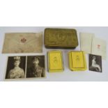 A Princess Mary Christmas 1914 tin containing cigarettes, tobacco, Christmas card and photograph,