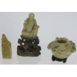 A carved hardstone Chinese figure of a scholar, a similar Chinese seal and a carved hardstone oil