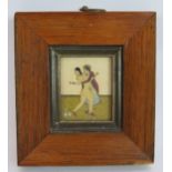 An Indian Mughal erotic miniature, hand painted with a couple copulating standing upright in an