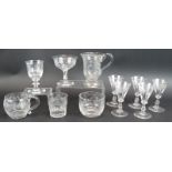 Eleven mixed ornately engraved 19th century glasses including a Queen Victoria monogrammed wine