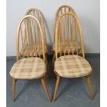 A set of four mid-century Ercol blonde Windsor Quaker dining chairs, with detachable seat cushions