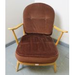 A mid-century Ercol Windsor 203 blond armchair, with loose seat cushions in brown draylon. Condition