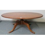 A Ercol ash golden dawn Chester 1191 oval coffee table, on splayed supports. Condition report: No