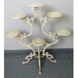 A 19th century cast iron plant stand in the manner of Coalbrookdale, with capacity for 6 pots, on