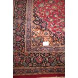A superb quality meshed carpet central motif on claret ground with blue border. 3.75 x 3.00