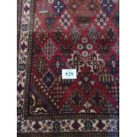 A Persian Melmeh runner on claret ground. 3.90x1.10 Condition report: In very good condition and