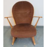 A mid-century Ercol blond Windsor rocking chair, with loose seat cushions in brown draylon.
