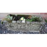 A nicely weathered reconstituted stone trough planter. Condition report: No issues. H25cm W64cm