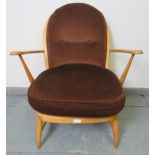 A mid-century Ercol blond Windsor 334 armchair, with loose seat cushions in brown draylon. Condition