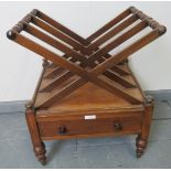 A Regency mahogany X frame Canterbury, with single base drawer, on turned tapering supports with