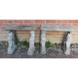 A pair of nicely weathered reconstituted stone garden tables, on supports in the form of dragons.