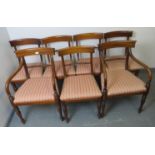 Seven (5+2) George III mahogany dining chairs, with scrolled backrests and rope twist stretcher,