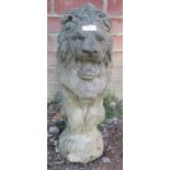 A nicely weathered reconstituted stone garden ornament in the form of a lion. Condition report: No