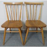 A pair of mid-century Ercol blond stickback occasional chairs, model 391. With removable seat