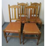 A set of four Arts & Crafts medium oak high back dining chairs in the Liberty taste, on tapering