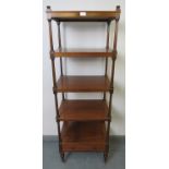 A Victorian mahogany 5 tier whatnot with single base drawer, on tapering turned supports with