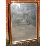 A large 19th century bevelled over mantle mirror in parcel gilt oak frame, with nicely silvered
