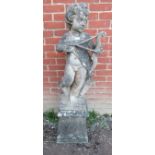 A nicely weathered reconstituted garden ornament in the form of cupid. Condition report: No
