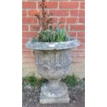 A nicely weathered reconstituted stone garden urn in the Grecian style. Condition report: No issues.