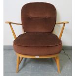A mid-century Ercol blond Windsor 335 armchair, with loose seat cushions in brown draylon. Condition