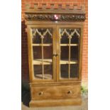 A 19th century mahogany Gothic revival linen press, with ornately carved and castellated cornice and