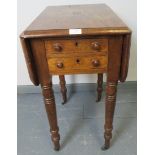 An early Victorian mahogany drop leaf work table, with two short drawers to one side and two dummy