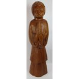 A large hardwood chip carved figure of a chorister praying. Height 95cm. Condition report: Natural