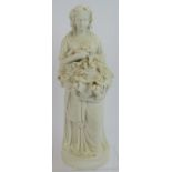 An antique Parian ware figure of a harvest maiden bearing grapes and vines. Height 28cm. Condition