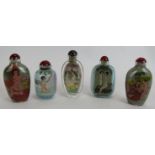 Five Chinese erotic inside-painted glass snuff bottles, 20th Century, depicting naked figures and