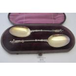 A pair of silver plated Apostle serving spoons with gilded bowls, boxed. Condition report: Good