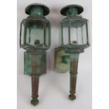 A pair of vintage carriage style lanterns with heavily patinated exteriors. Height 50cm. (pr).