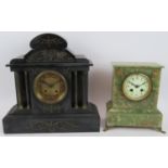 A 19th century black slate striking mantle clock with brass dial and hunting frieze pediment and