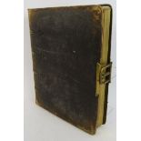 A 19th century leather bound photo album with cut out decorated pages and gilt brass fittings