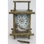 An early 20th Century French 8 day carriage clock with hand decorated enamel panels and dial